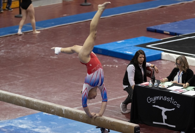A Huron Valley United gymnast competes on balance beam. 