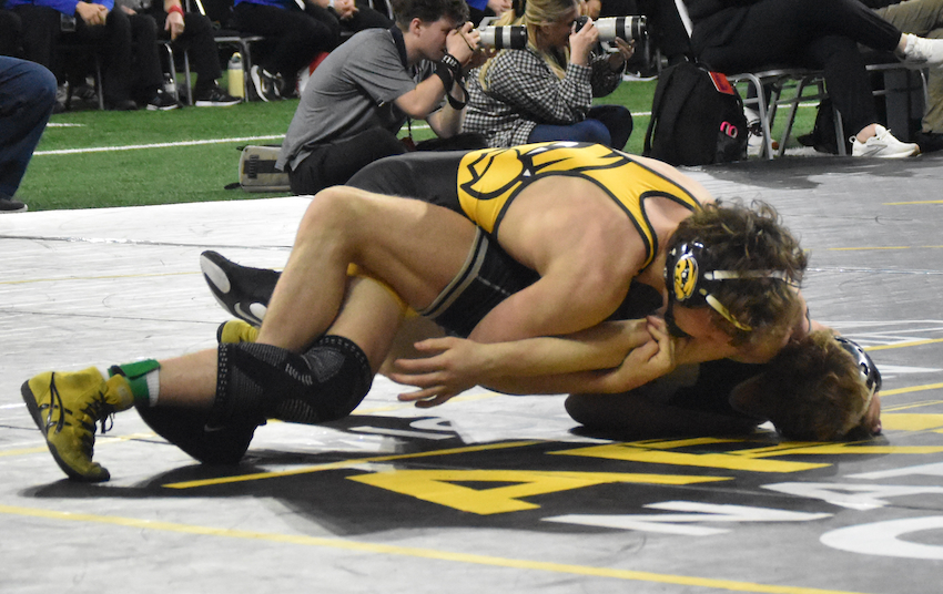 Hamilton’s Bryce Morrison, top, works toward a win at 150 pounds.