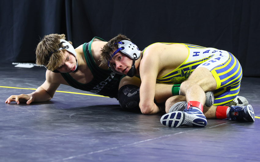 Hartland’s Bohdan Abbey, right, wraps up the legs of his opponent.