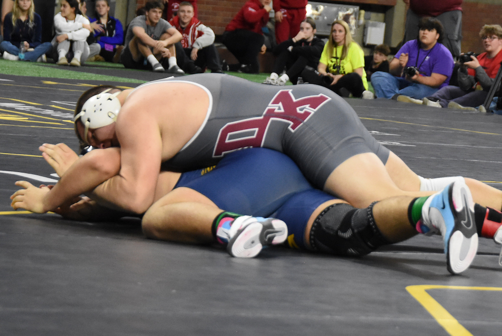 Delton Kellogg’s Mitchell Swift, top, works toward his first championship against Columbia Central’s Dylan Boone.