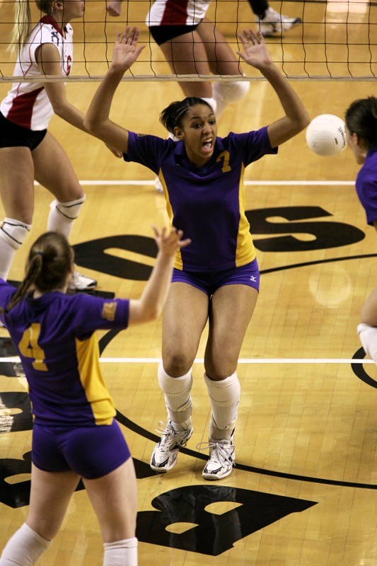 Glass celebrates with her teammates during a match.