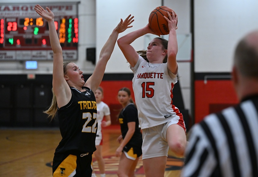 Marquette's Avery Osborne goes up for a shot against Traverse City Central's Sienna Slack during the Sentinels’ 51-43 District Final victory in Division 1.