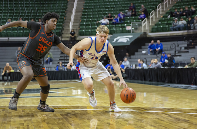 Tourtillot makes a move into the lane while guarded by Douglass’ Dimauvion Smith-Powe (35). 