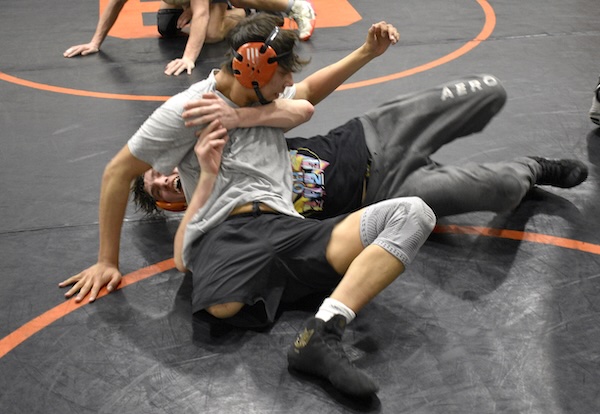 Wesaw, top position, works on a move against a practice partner during the week of Individual Regionals. 