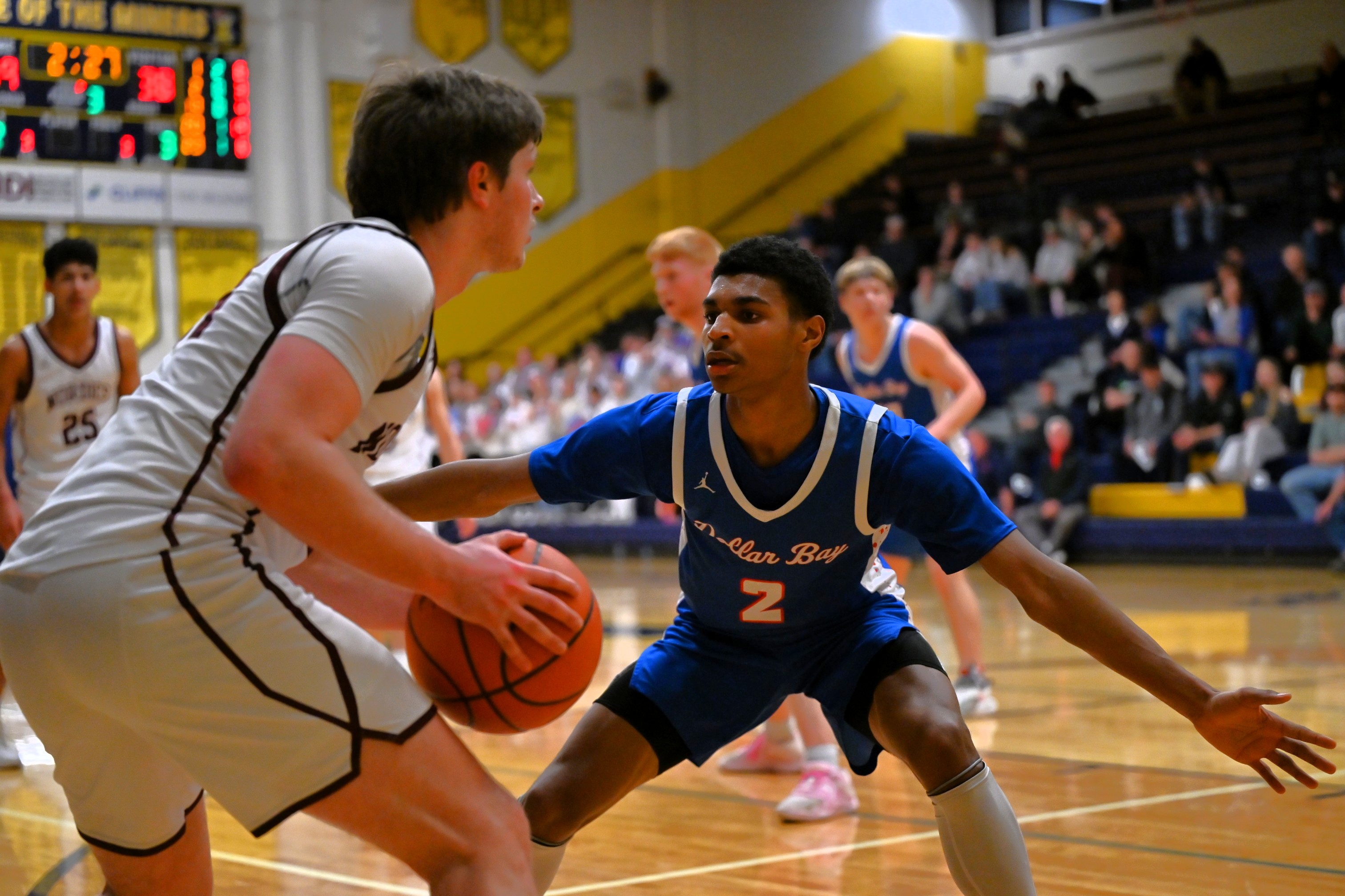 Dollar Bay's Baron Colbert (2) guards Spencer Kramer during the Blue Bolts’ Regional Final win over Felch North Dickinson.