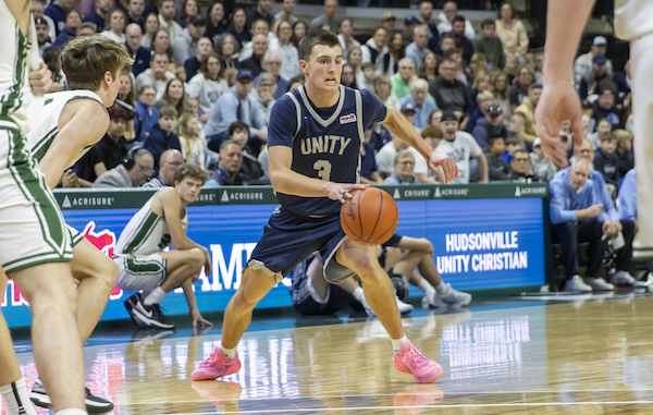 Unity’s Kyler Berghuis (3) dribbles into an opening just inside the arc.