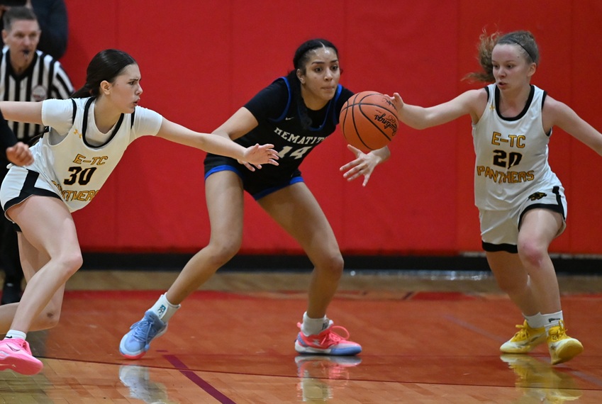 Ewen-Trout Creek's McKayla Basel (30) and Bree Besonen (2) and Ishpeming's&nbsp;Mya&nbsp;Hemmer go after a loose ball during their Division 4 Regional Final.