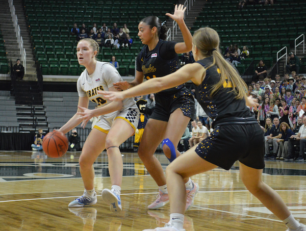 The Bucks’ Nemiah Carper (24) and Cami Hamina defend the lane as P-W’s Adrianna Eklund (10) looks to the perimeter.