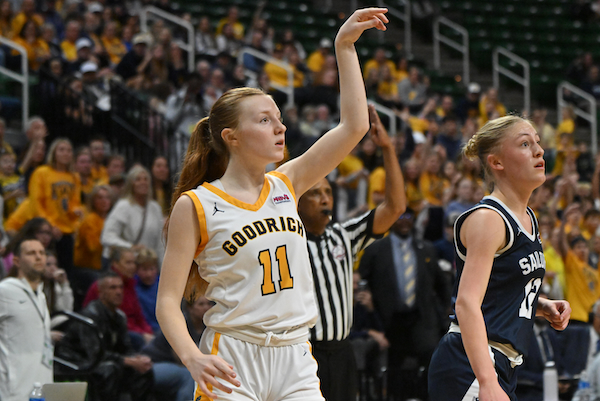 The Martians’ Sydney Place (11) and Sailors’ Sophia Prins watch Place’s shot fall as the official signals a 3-pointer.