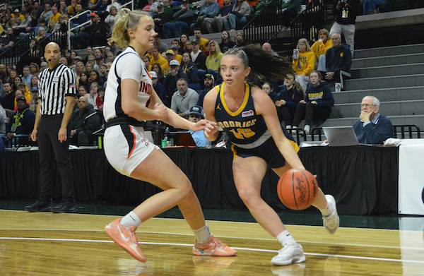 Goodrich’s Kaylee Eickhoff (10) makes a move on the baseline with Avery Zajac defending.