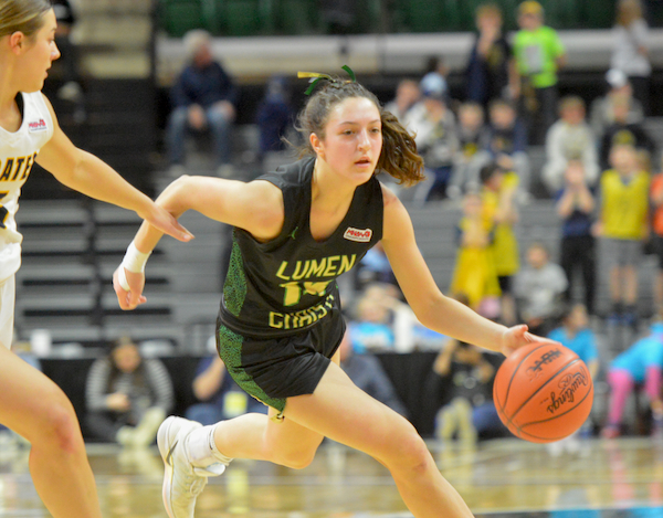 he Titans’ Lucy Wrozek (14) makes a move around a P-W defender.