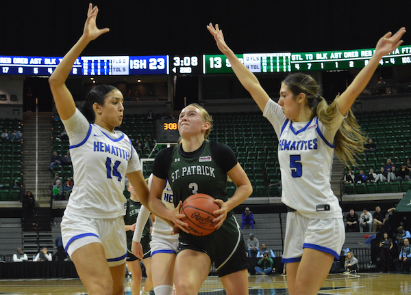 Mya Hemmer (14) and Brittanie Piotrowski (5) surround St. Patrick’s Gracelyn Rockey as she drives.