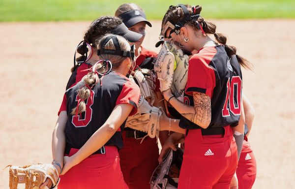 Paw Paw's players huddle at the pitching circle. 