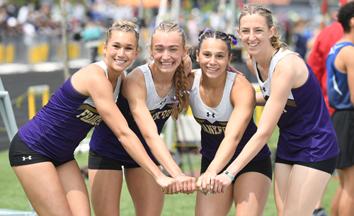 From left: now-graduated Gwyneth Dunaway, Luther, Alaimo Schindler and Addison Jarosz take a photo at last year's Finals holding their golden baton.