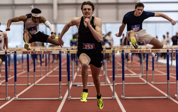 Dzurka, middle, leads a hurdles race during an indoor meet at Saginaw Valley State.
