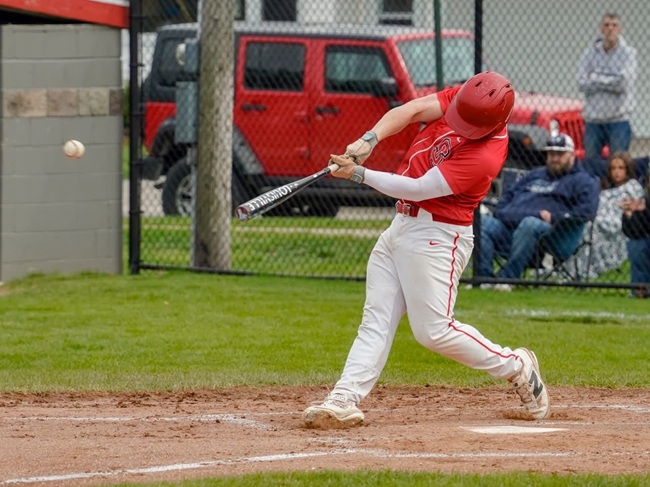 Senior Oliver Smies connects with a pitch. 