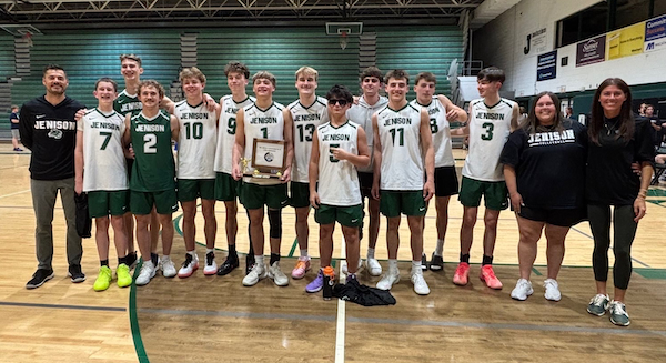 Cochran and his teammates pose for a photo with a trophy in hand. (