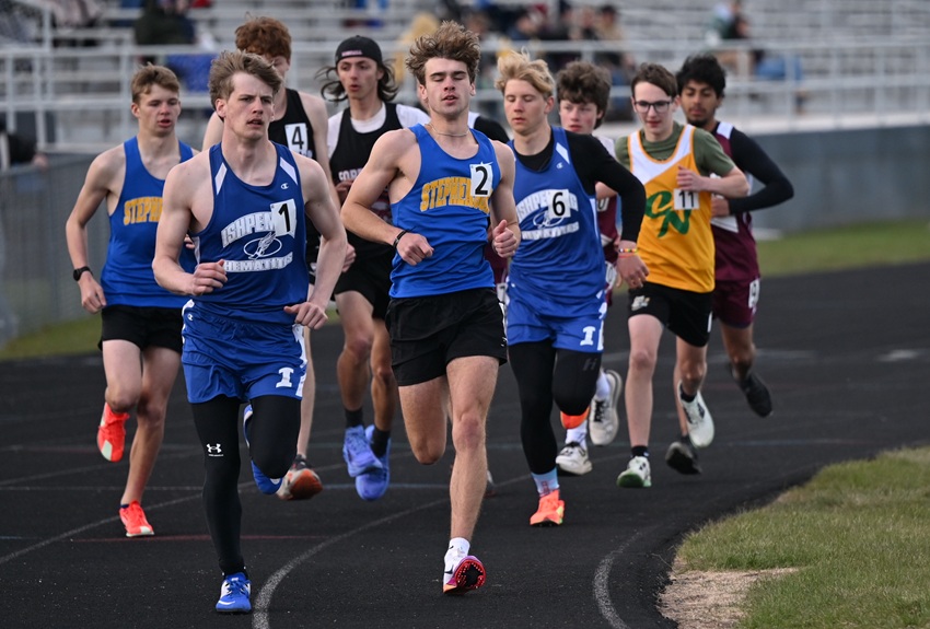 shpeming's Kemper Gearhart (1) leads the beginning of the 1,600 with Stephenson's Canon Kuntze (2) getting into position to follow during the UPD3 Regional on May 18 at Ishpeming.