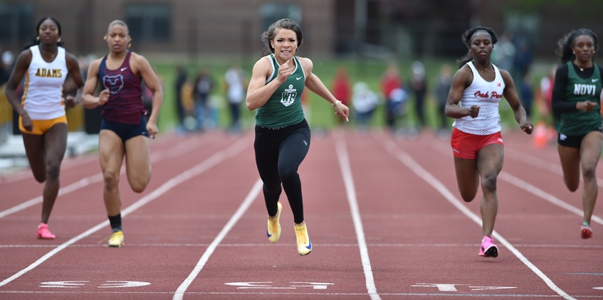 West Bloomfield’s Kamryn Tatum, middle, sprints to an Oakland County championship Friday. 