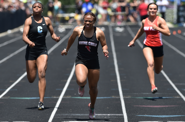 Dearborn Divine Child's Aubrey Wilson pushes through the finish of a sprint championship.