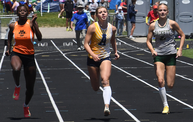 Alcona's Addi Beatty, middle, runs to the 100-meter dash title.&nbsp;