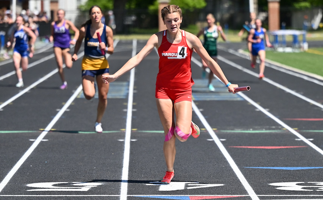 arquette's Jordyn Anthony, center, gets ready to lean for the finish line during a Sentinels relay victory. 