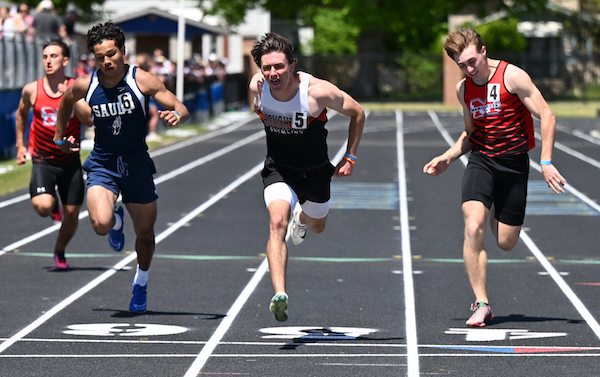 In a very close 200, Houghton's Sam Roth, second from left, crosses the finish line ahead of Richardson (4) and Sault Ste. Marie's Kyan Hemenway (6). 