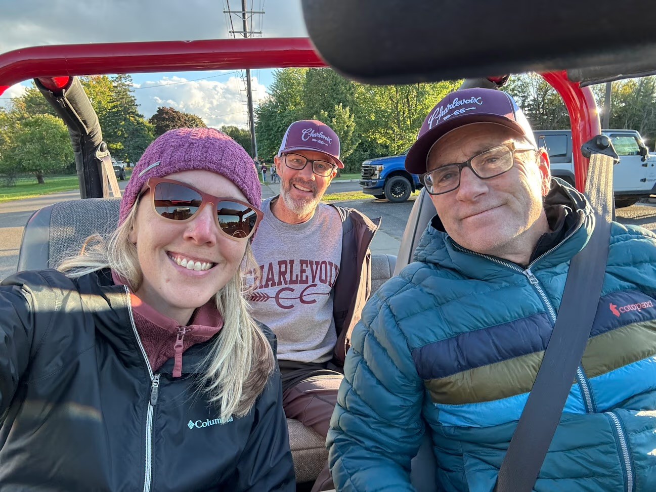 Drenth, back seat, rides in the Charlevoix Homecoming parade this past fall with wife Tricia in a vehicle driven by assistant golf coach Bruce Beaudoin. 