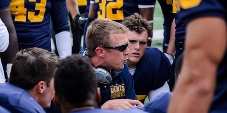  Kohn huddles with his Siena Heights football team.