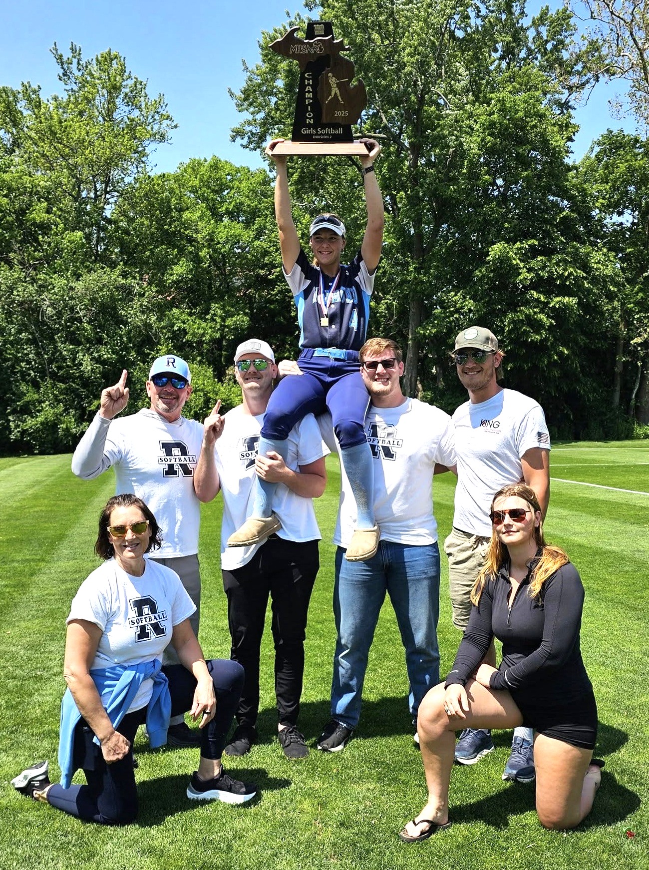 The McKiernans celebrate Anna’s softball team’s championship last spring.