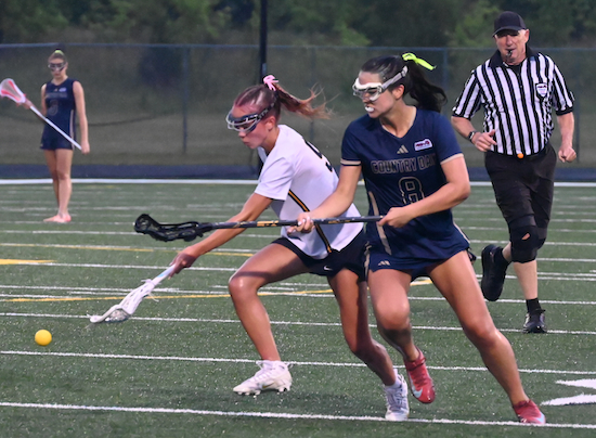 DCD's Jackie Calso (8) and EGR's Ella Alguire (9) contend for the ball.