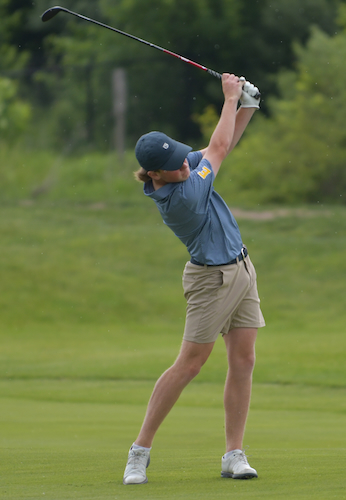 An East Grand Rapids golfer holds his backswing after advancing the ball. 
