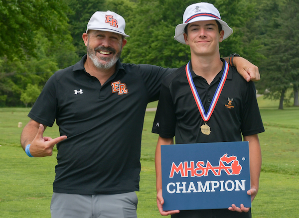 Elk Rapids Blake Springstead, right, poses for a photo with his coach.