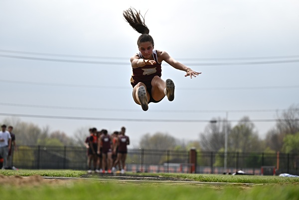 Makenna Price sails through the air for Niles Brandywine in the long jump.