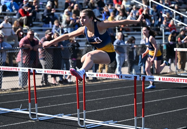  Negaunee's Sadie Rogers leads and eventually wins the 100 hurdles April 21 at Marquette. 