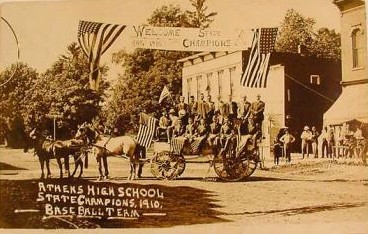 The 1910 team is welcomed during a parade through its hometown. (
