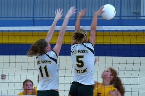 Gillis, right, blocks a kill attempt for West’s volleyball team.