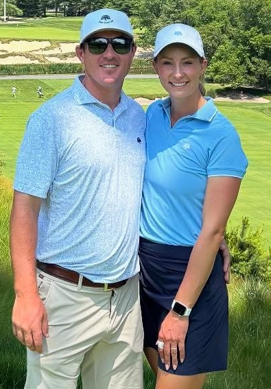 Gillis stands for a photo with her husband Tim, who also serves as a pro at John’s Island.