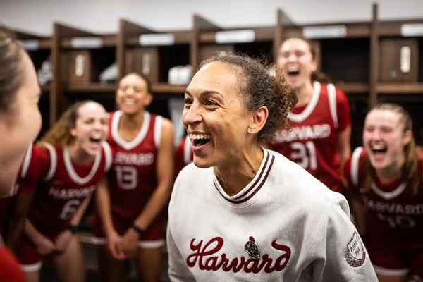 Moore enjoys a moment with her Crimson players. 