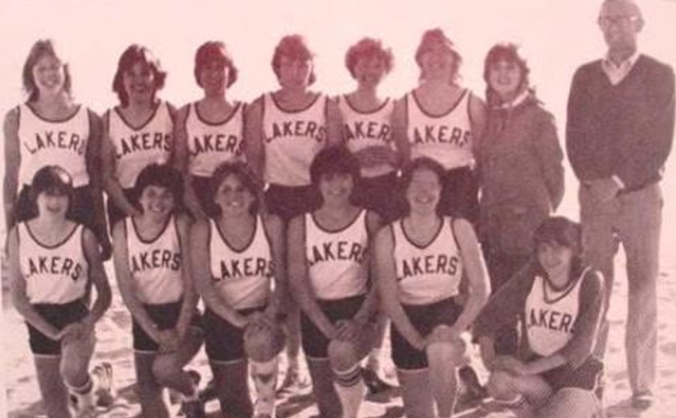 Bennett, front row and fourth from left, poses for a team photo with her high school track team.