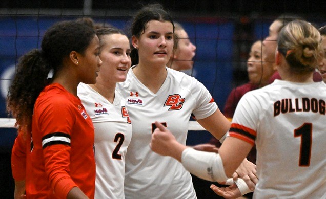 Johnson huddles for a moment during that match with her teammates including, from left, Kinsley Whitfield, Lainey VanTol and Caitlin Hartson.