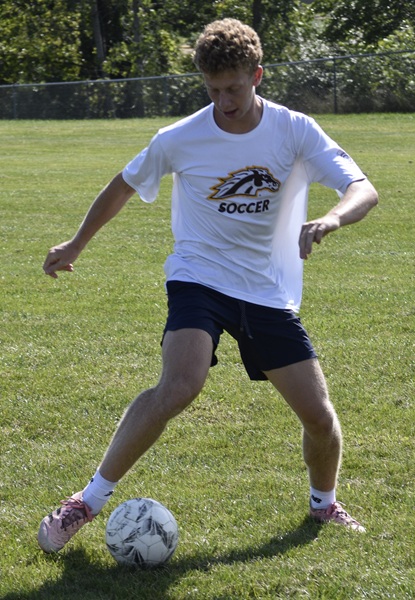 Senior Law Gates works on his ball control during a recent practice. 