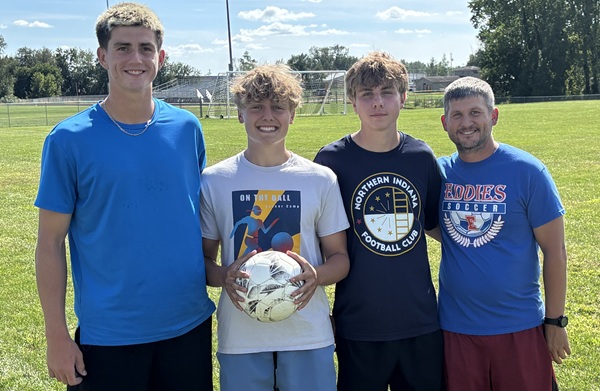 Eddies boys soccer coach Sean Jesse, far right, poses for a photo with key returnees, from far left, Brayden Fischer, Landon Goetz and Collin Tefft.