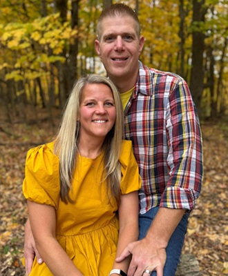 Disbrow stands for a photo with wife Nikki last fall.