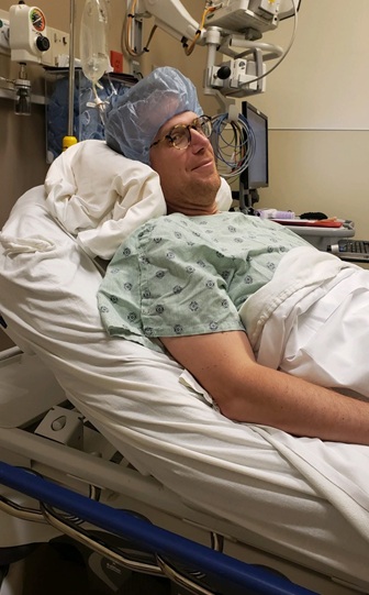 Disbrow lays in a hospital bed while receiving care in 2023.