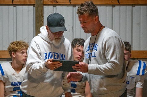 Fairfield, left, and Czerwon look at an iPad during halftime of a 28-0 victory over Mason County Central on Friday.