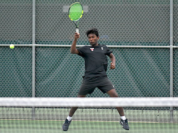 Troy’s&nbsp;Siddarth Manikandan sends back a powerful volley during a No. 2 doubles match.