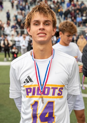 Corder wears his championship medal. 