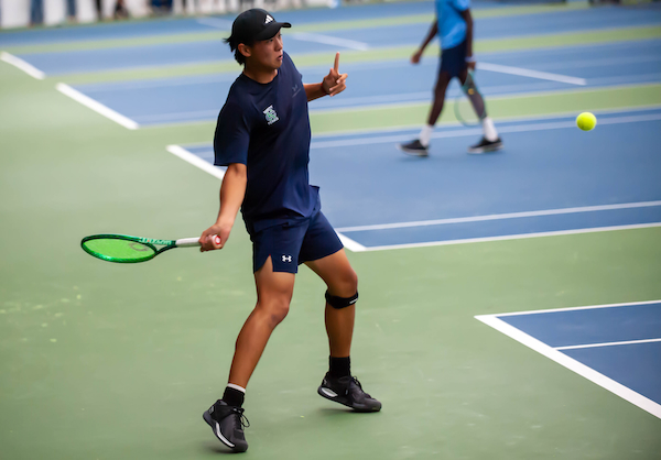 Cranbrook’s Jacob Yang sends a forehand at No. 1 singles. 
