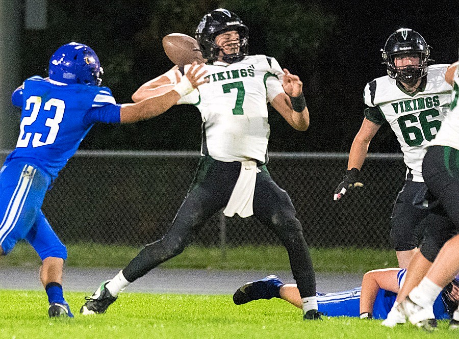 Grayling's Jaden Peters (7) winds up to throw a pass during his team's 42-0 win at Bath. 